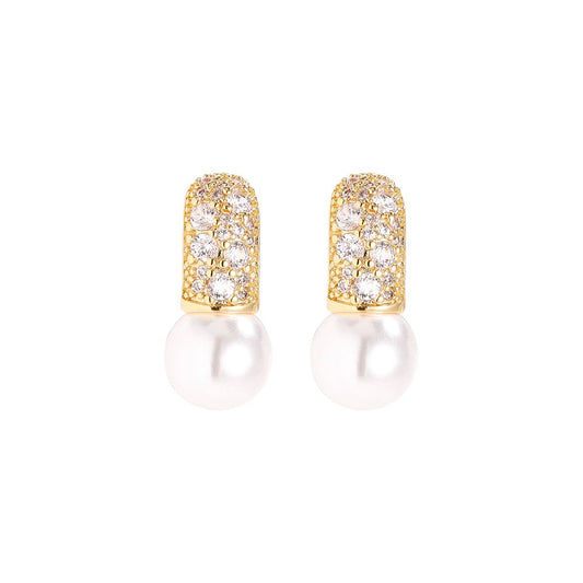 Gold earrings with pearl and sparkling cubic zirconia detail.