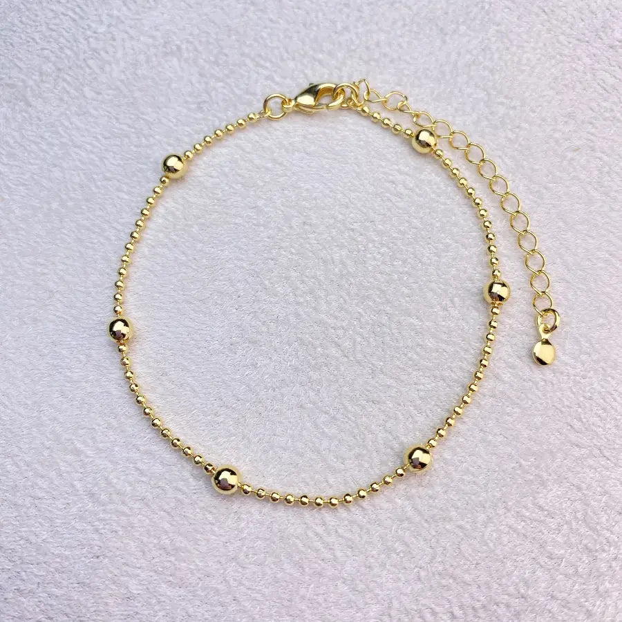 Gold-plated bracelet with beads, 18K gold plating.