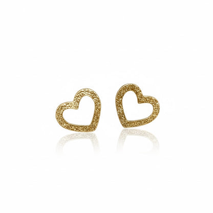 Gold-tone hollow heart earrings with a shiny texture.