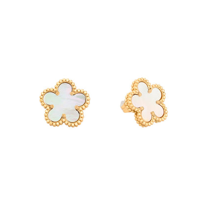 Gold-tone steel earrings with a black clover.